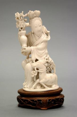SEATED GUAN YIN WITH DEER AND VASE